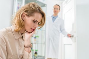 female patient with dental anxiety at the dentist's office